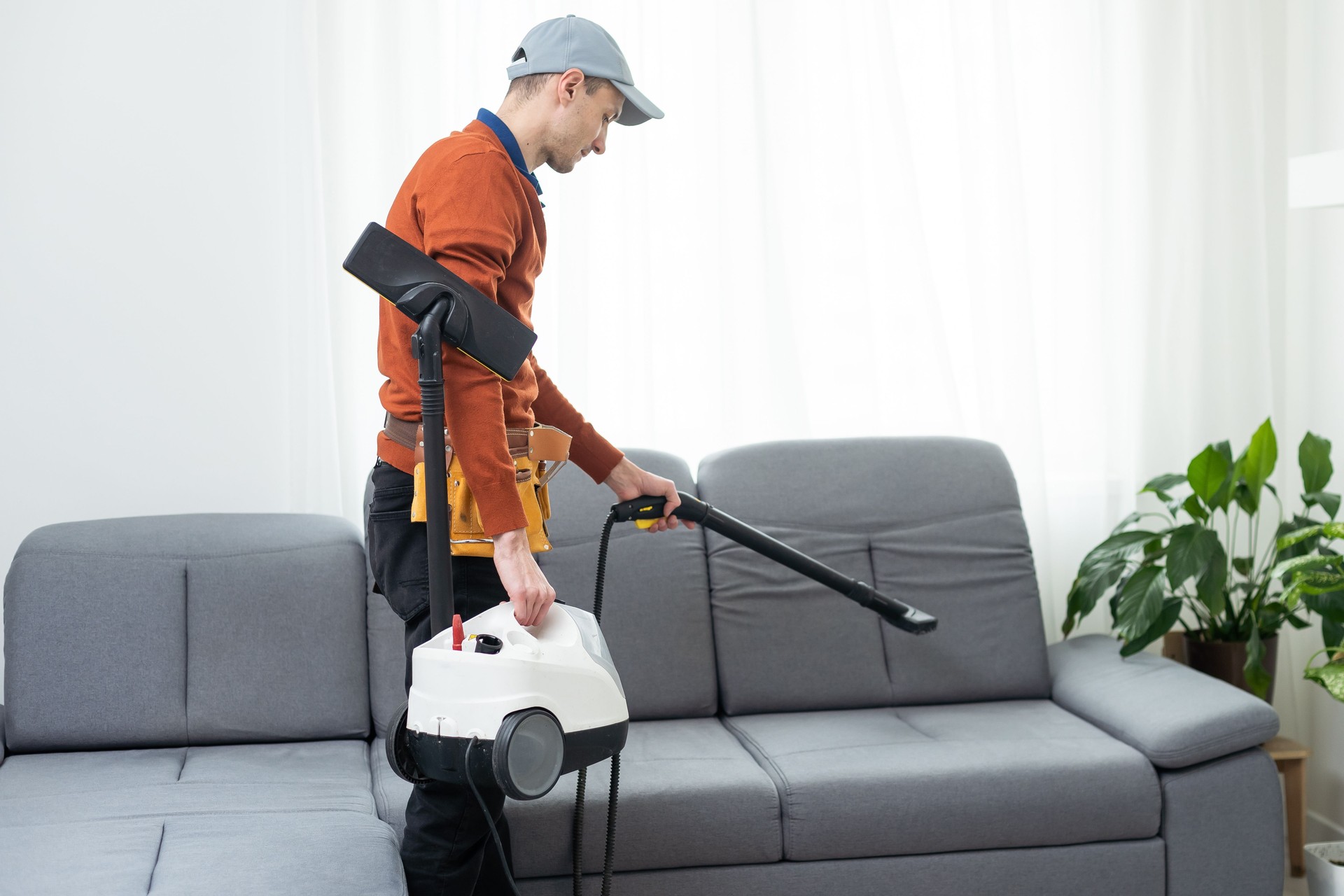 Process of deep furniture cleaning, removing dirt from sofa. Washing concept.