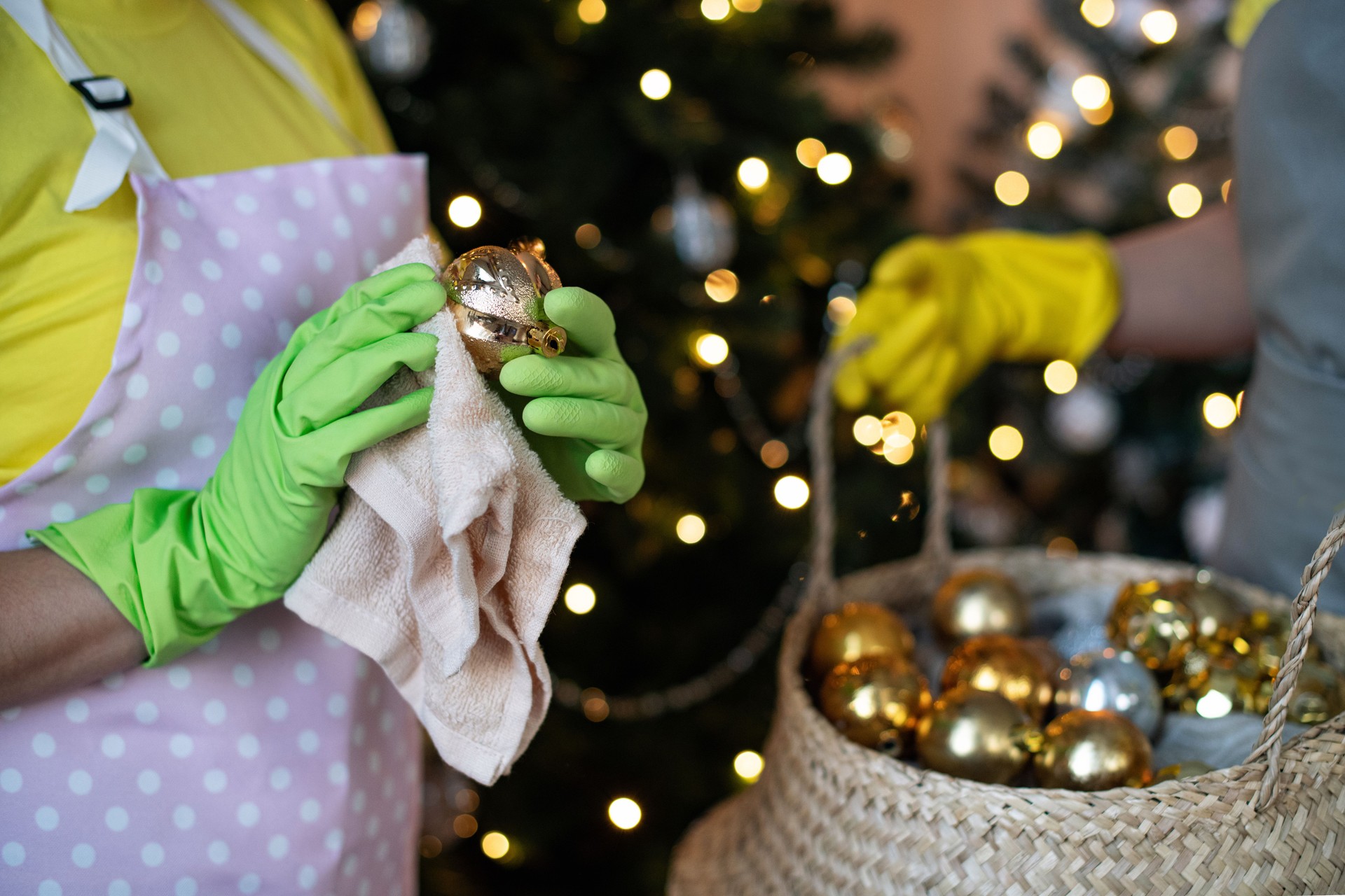 Preparing For Christmas Backet With New Year's Decorations In Hands Cleaning Before Winter Holidays.